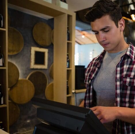 Man using cash register at bar man using cash register